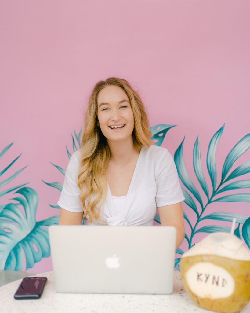 social media manager working on laptop while traveling